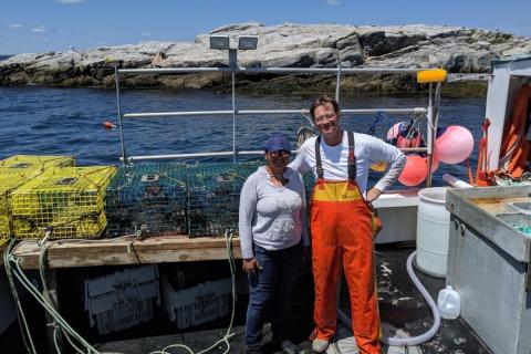 A local, Gulf of Maine lobsterman working with an SML student on Appledore Island. Photo credit: SML