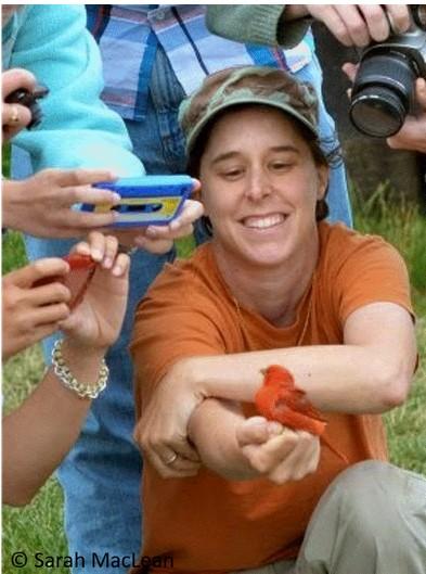 an image of a woman holding a bird