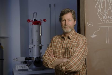 Jan Factor standing with lab equipment in background