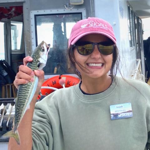 Anjali with a fish in hand