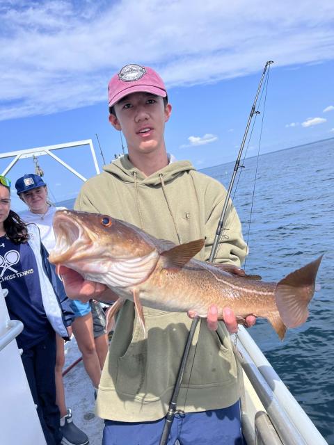 student with codfish